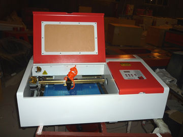 Chiny Desktop Laser Engraver Co2 Laser Engraving And Cutting Machine For Carving Chapter And Artistic Works dostawca